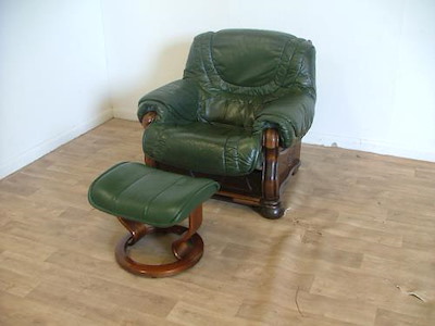 Green Leather Armchair And Stool.